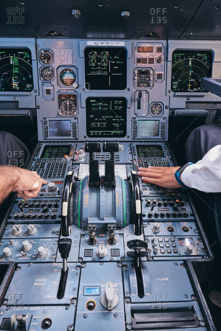 Pilots working in cockpit during flight