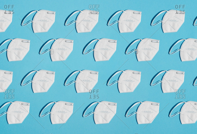 collage of masks for protection factor KN95 on a blue background zenith view