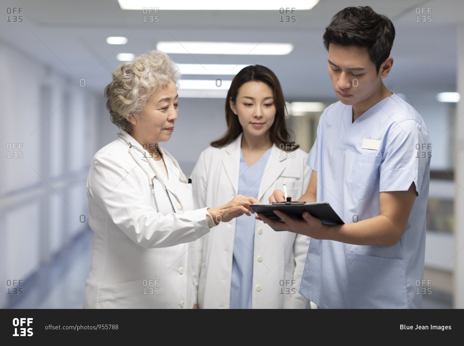 Chinese doctors talking in hospital corridor
