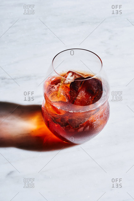 Negroni - popular Italian cocktail, made of gin, red vermouth and Campari, garnished with orange peel.