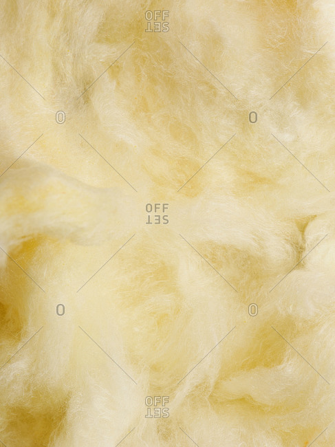Soft yellow fluffy banana flavored cotton candy background