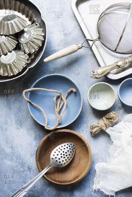 Still life of vintage kitchen utensils, bowls and cake tins.