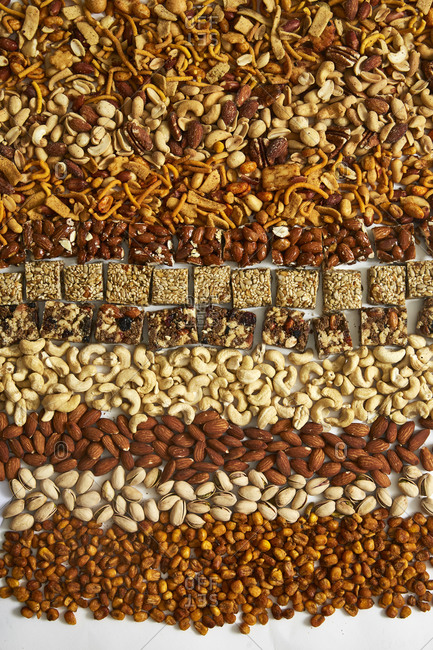 Overhead view of a variety of nuts and nut bars