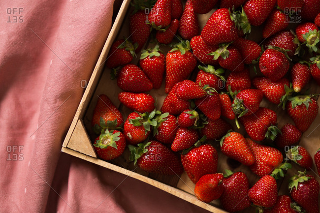 Overhead view of fresh strawberries in basket