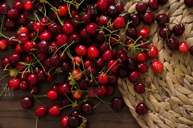Overhead view of fresh picked cherries on table