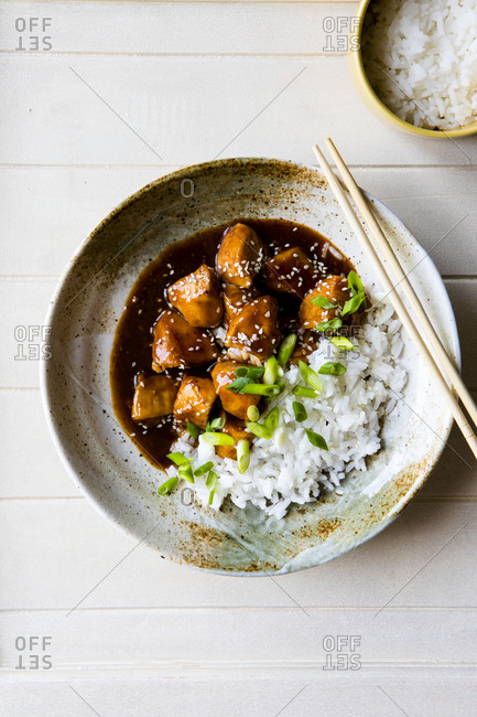 Overhead view of Orange Sesame Chicken with Rice in a bowl