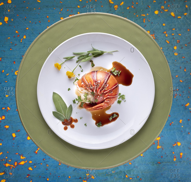 Cooked lobster plated with herbs