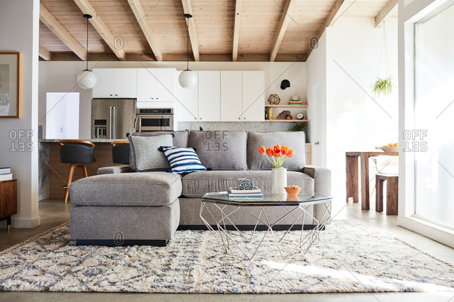 June 1, 2020: Gray sofa with chase in a modern home