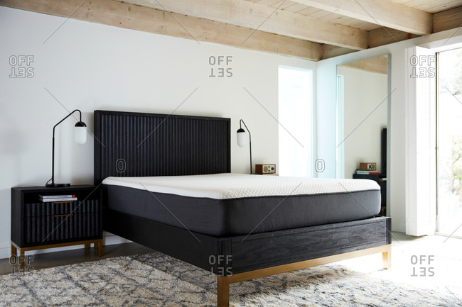 June 1, 2020: Modern bedroom with bare mattress