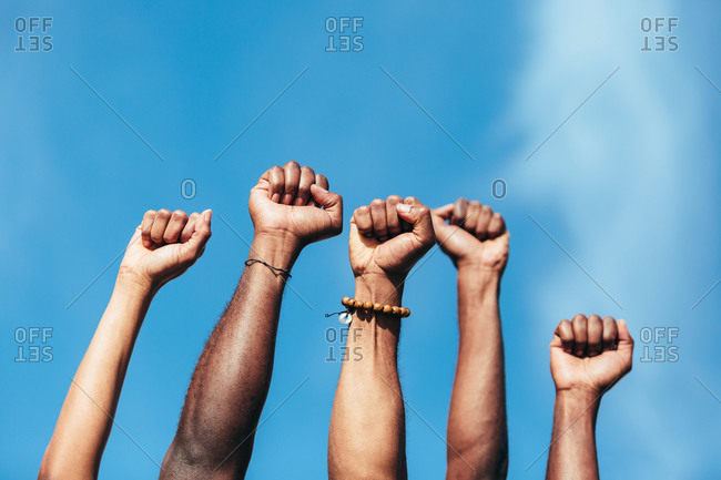 Fists of anonymous persons as a gesture against racism.