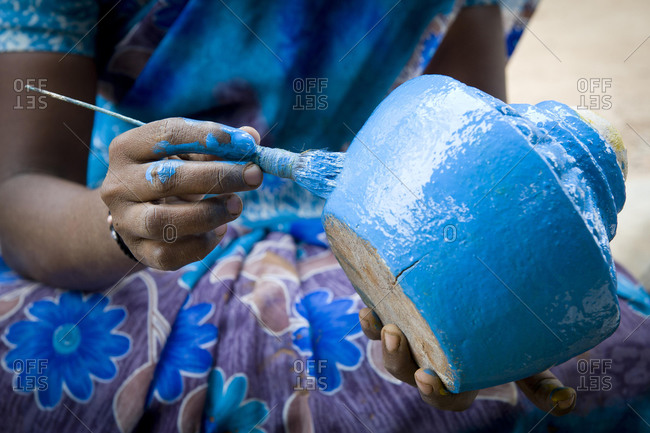 Hands molding clay in a pottery and ceramic studio in Chiang Mai, Thailand  stock photo - OFFSET