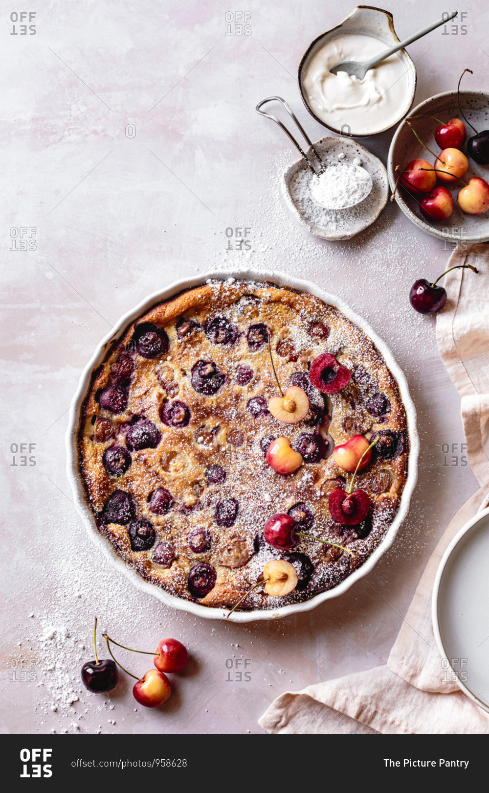 Cherry clafoutis dusted with icing powder.