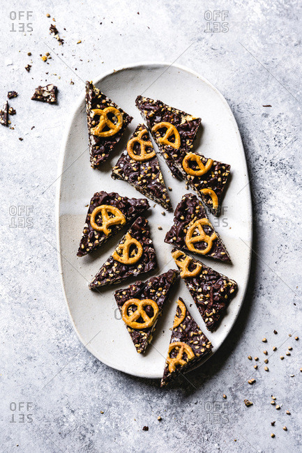 Pieces of chocolate pretzel bark on a plate.