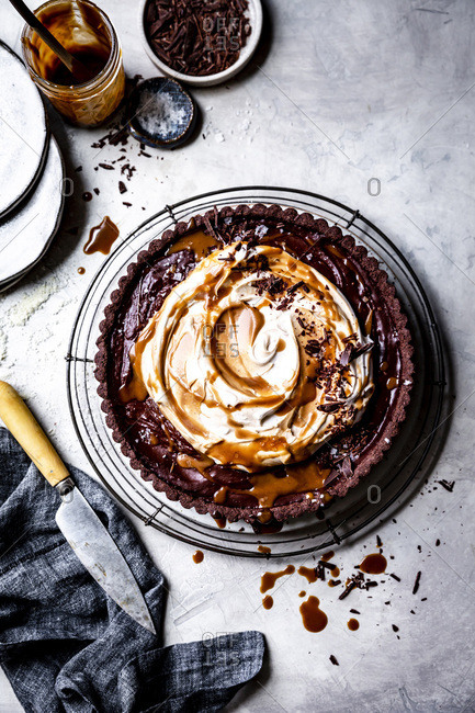 Gluten free vegan chocolate tart with whipped coconut cream.