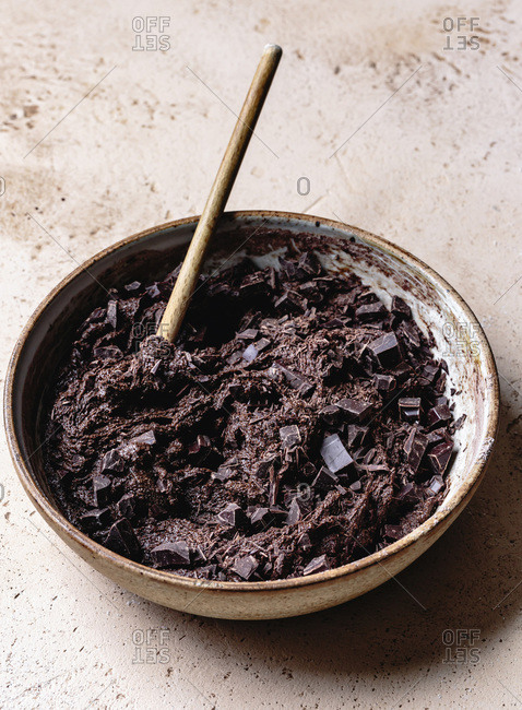 Chocolate pieces added to double chocolate ginger cookie mixture.