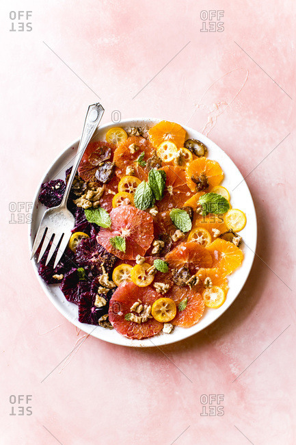 Winter citrus salad on a plate with a fork.
