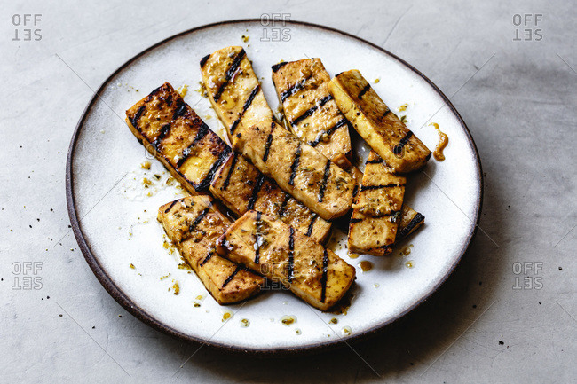 Pieces of grilled marinated tofu.