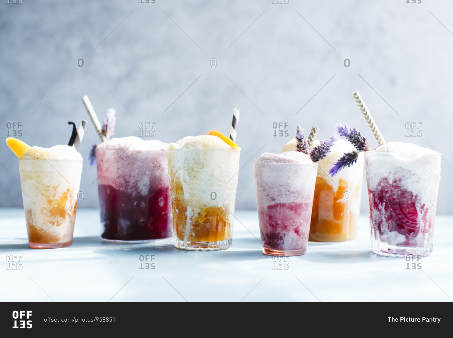 Various Ice cream floats with lavender and straws