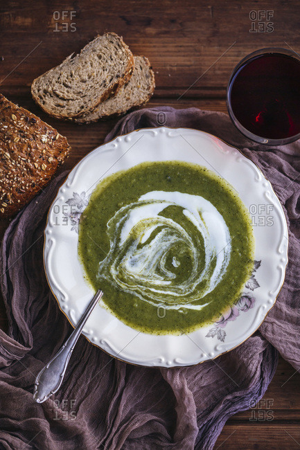 Broccoli soup with yogurt served in a vintage plate
