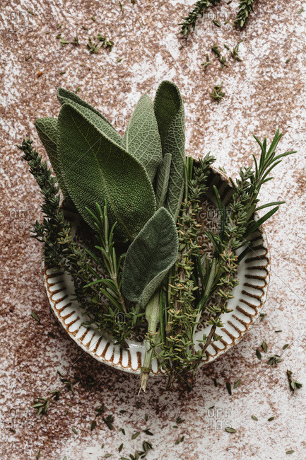 Rosemary, thyme and sage into a mini bowl