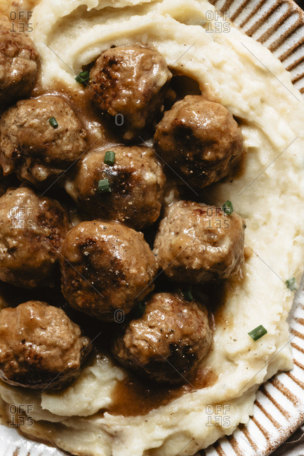Closeup of mashed potatoes and meatballs on a plate