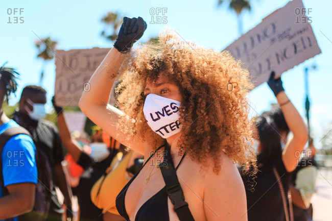 woman with raised fist stock photos - OFFSET