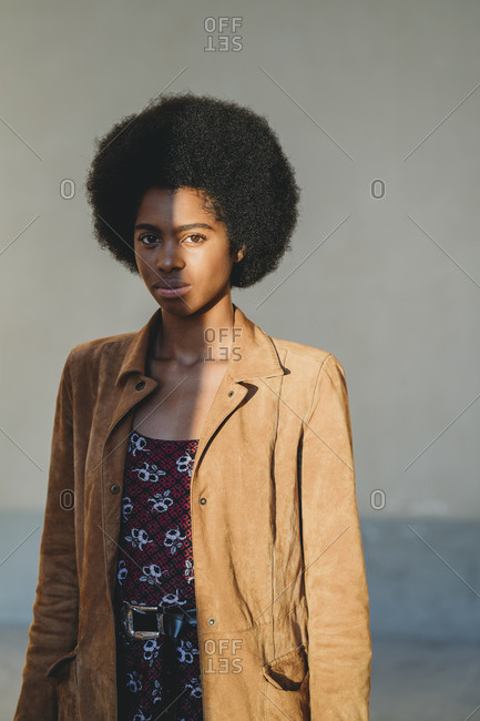 Young woman with afro hair in corridor