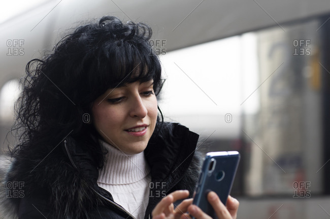 Beautiful smiling pregnant woman in black suit talking by phone Stock Photo  by ©Kryzhov 158114272