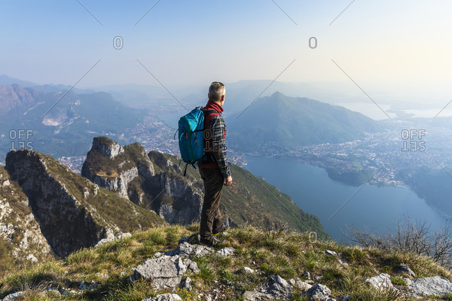 Rear view of hiker on mountaintop- Orobie Alps- Lecco- Italy