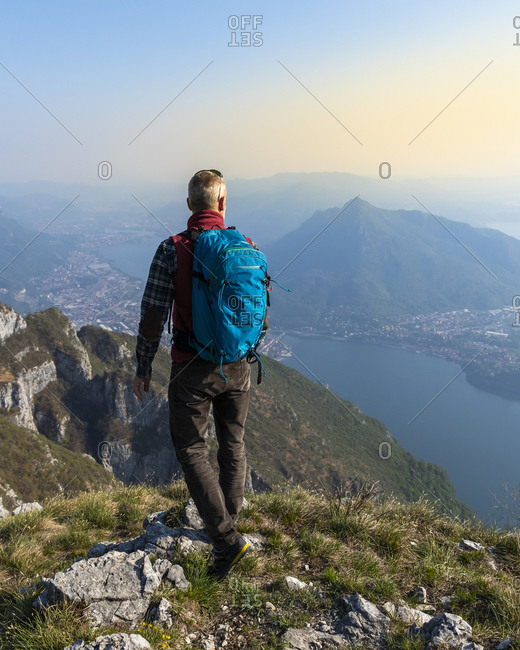 Rear view of hiker on mountaintop- Orobie Alps- Lecco- Italy