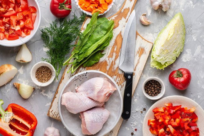 Fresh raw chicken on cutting board and spices for cooking Stock Photo by  ff-photo