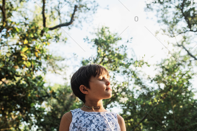 Portrait of a young girl soaking up the summer sun