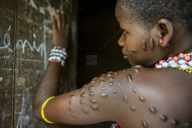 December 2,  2015: Girl with scarification of the tribes of northern Benin, Africa