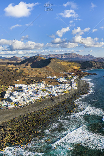 Spain, Canary Islands, Lanzarote, aerial view of El Golfo village and  the volcanic landscape of Timanfaya National Park and the Volcanos Natural Park