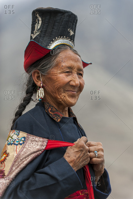 Nubra Valley - July 2, 2011: A Nubra woman wears traditional dress to  attend a gathering at a local monastery stock photo - OFFSET