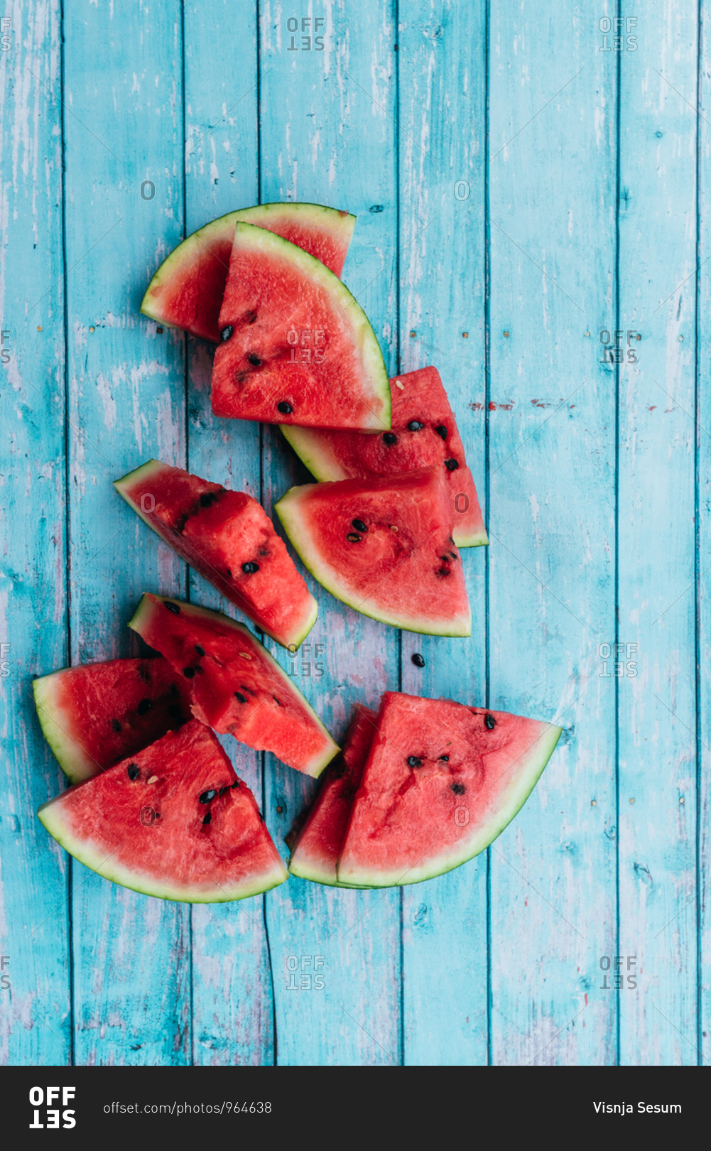 Sliced watermelon triangles on a blue background