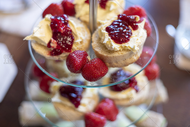 Traditional English strawberries, strawberry jam and clotted cream with scones