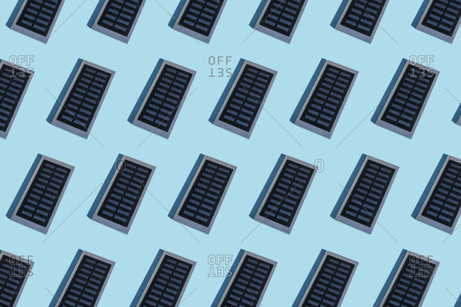 Rows of portable solar panel on blue background