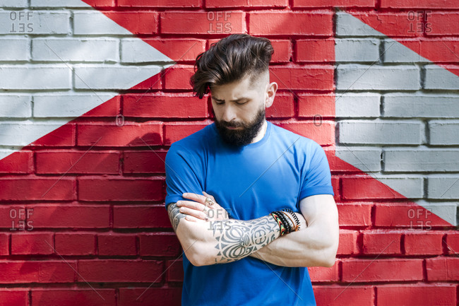 Bearded Tattooed Male In A Red Shirt Over Dark Forest And Cloudy Sky Stock  Photo Picture And Royalty Free Image Image 62831953