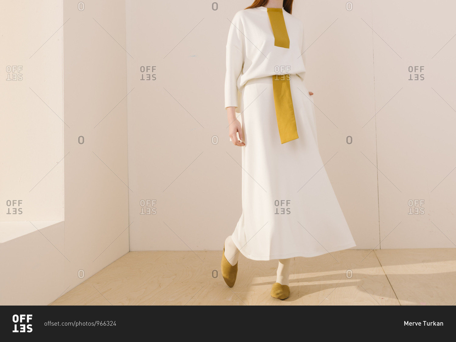 Young Model Standing By Window Wearing A Stylish White And Yellow Outfit Stock Photo Offset