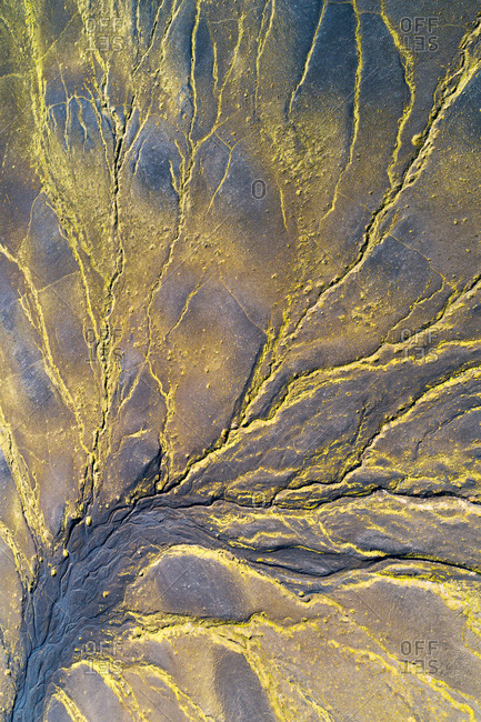 Aerial view, shot straight down, of green lines on a mountainside in Veidivotn in the highlands of Iceland