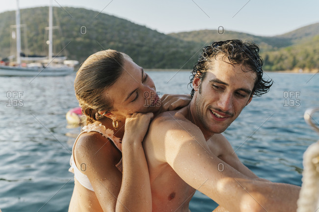Affectionate couple by seaside, Italy