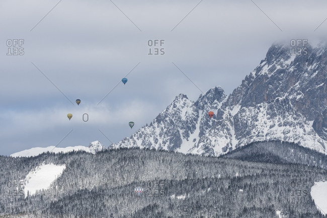 January 24, 2018: View from Rohrmoos, Dachstein massif, hot air balloons, Austria