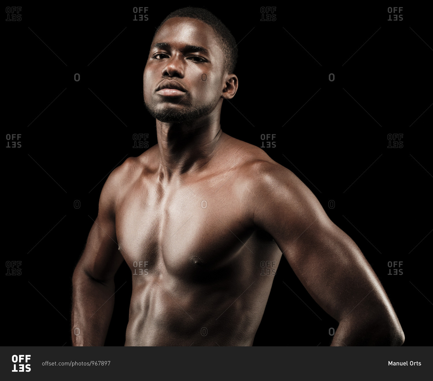 Close up of a shirtless black fitness man wearing sport short trousers ...