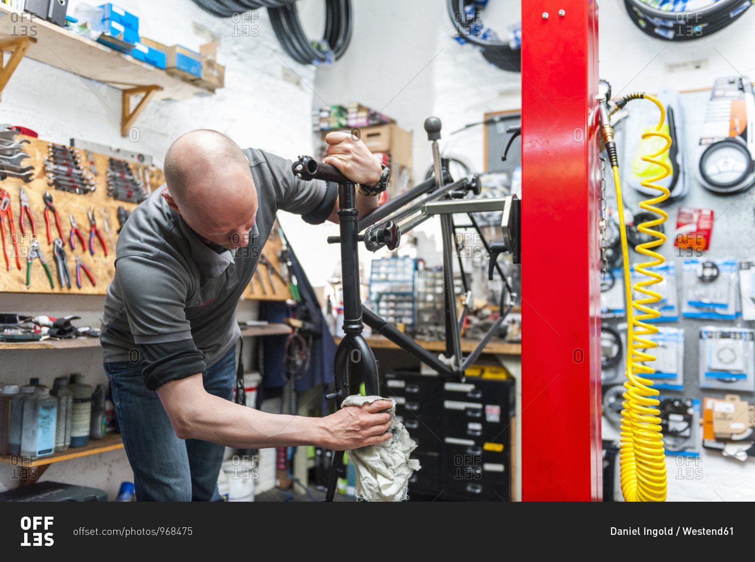 Bicycle mechanic working in bike shop
