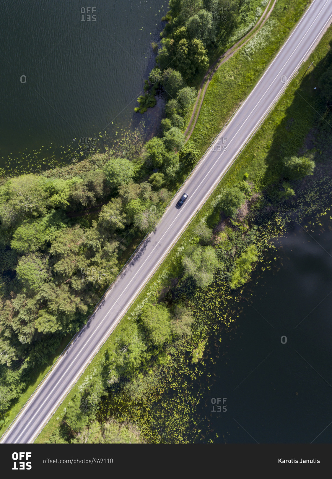 Bird's view of a road across a lake