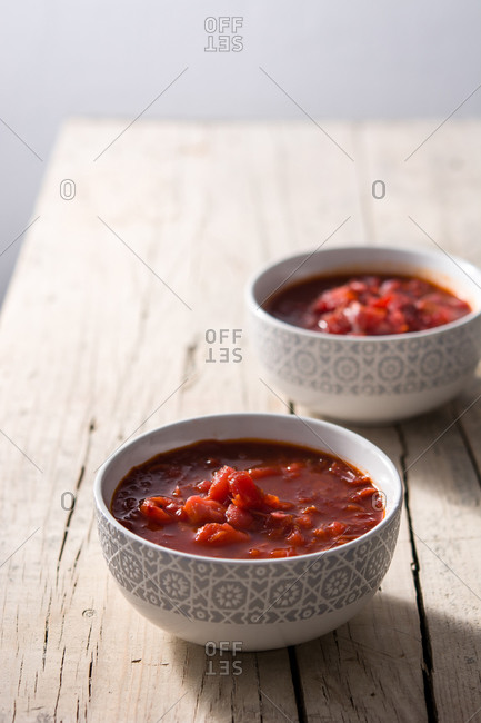 Traditional Ukrainian Russian borsch. Beetroot soup on rustic wooden table.