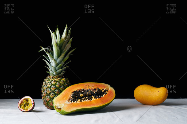 Still life with pineapple, papaya, mango and passion fruit