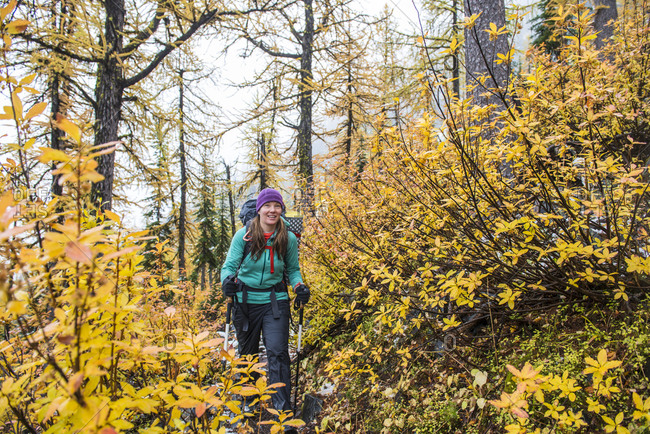 Woman hiking in Pasayten Wilderness in autumn, Washington State, USA