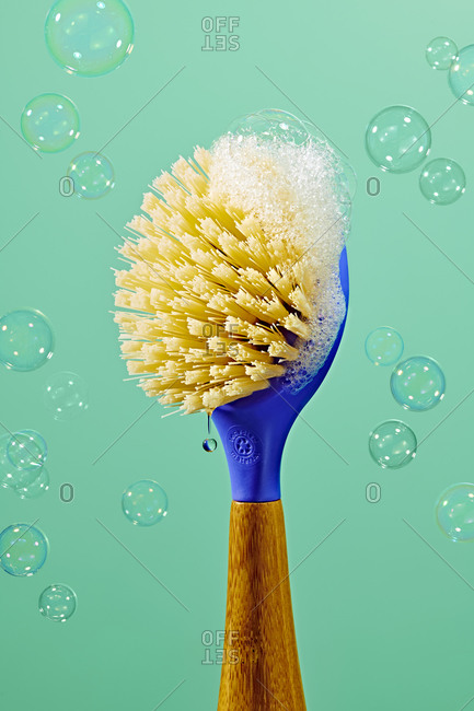 Scrub brush with suds and Bubbles